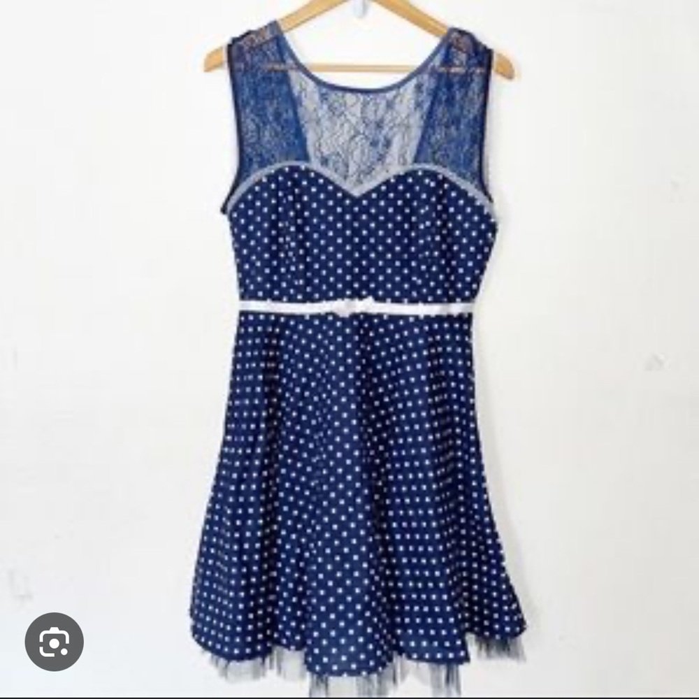 Blue and white lace swing dress with polka dots and open back